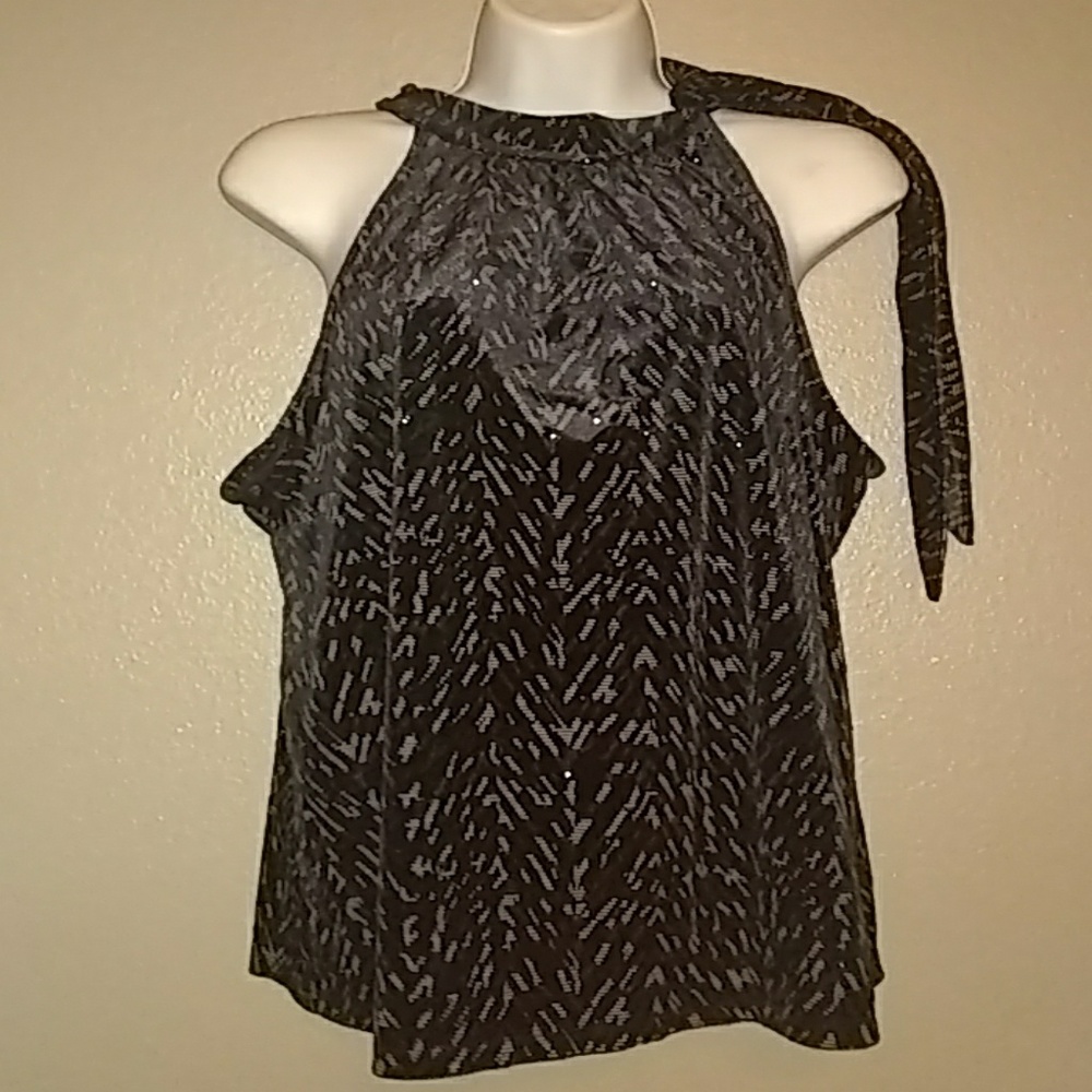 Blouse has a tie around the neck